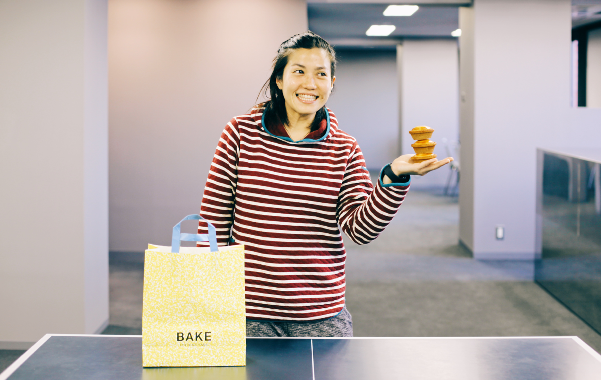 Kerry always staying positive. The cheese tarts she’s holding are samples.